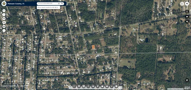 a bathroom with a glass shower door and mirror