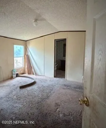 a bathroom with a granite countertop sink a mirror a vanity and a shower