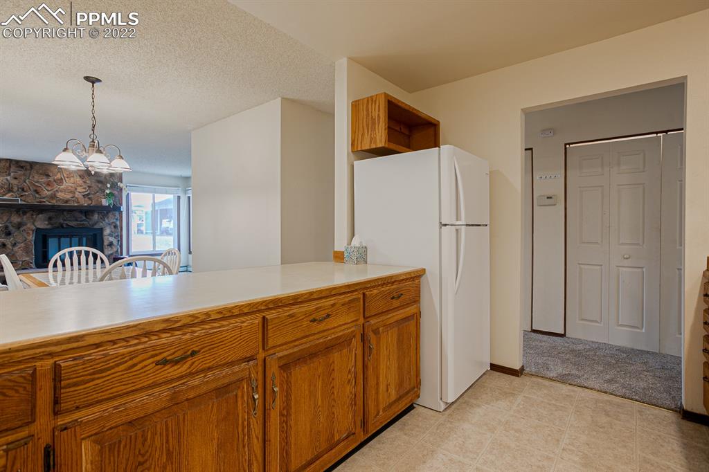 1140 Magic Lamp Way, Unit 3 Monument, CO 80132 - Photo 16 of 26 a view of a kitchen with granite countertop cabinets and stainless steel appliances