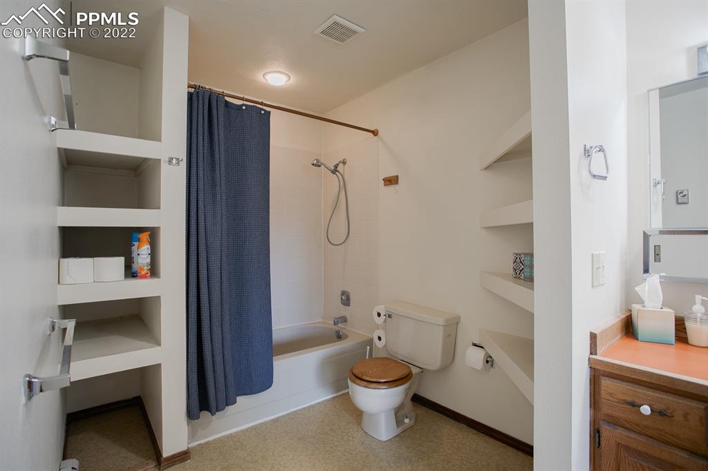 1140 Magic Lamp Way, Unit 3 Monument, CO 80132 - Photo 24 of 26 a bathroom with a toilet a sink and shower
