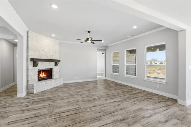 a view of an empty room and fire place