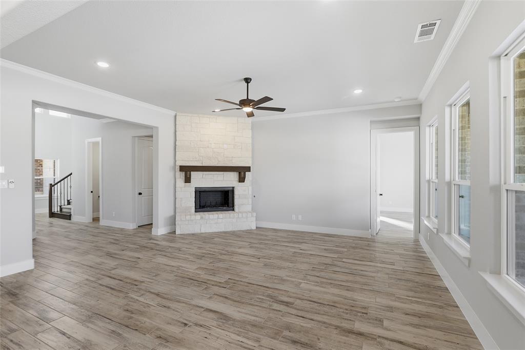290 Cofer Road Leonard, TX 75452 - Photo 16 of 40 a view of a livingroom with wooden floor and a ceiling fan