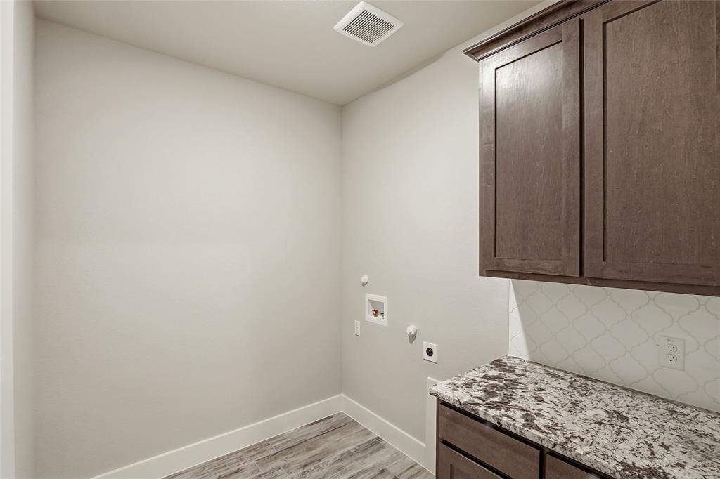 290 Cofer Road Leonard, TX 75452 - Photo 22 of 40 a bathroom with a granite countertop sink and vanity