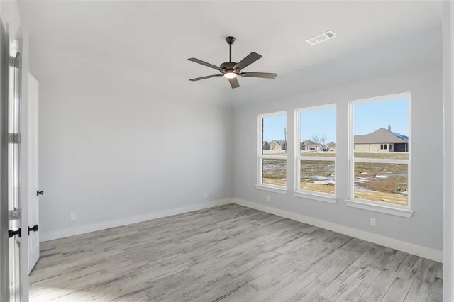 a bathroom with a granite countertop sink and vanity