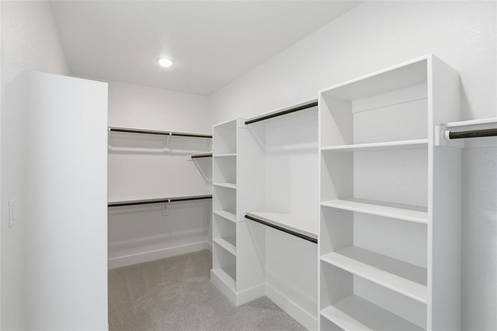 290 Cofer Road Leonard, TX 75452 - Photo 25 of 40 a view of walk in closet with empty racks
