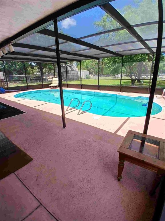 9739 Ray Street Hudson, FL 34669 - Photo 9 of 36 a view of a backyard with a slide