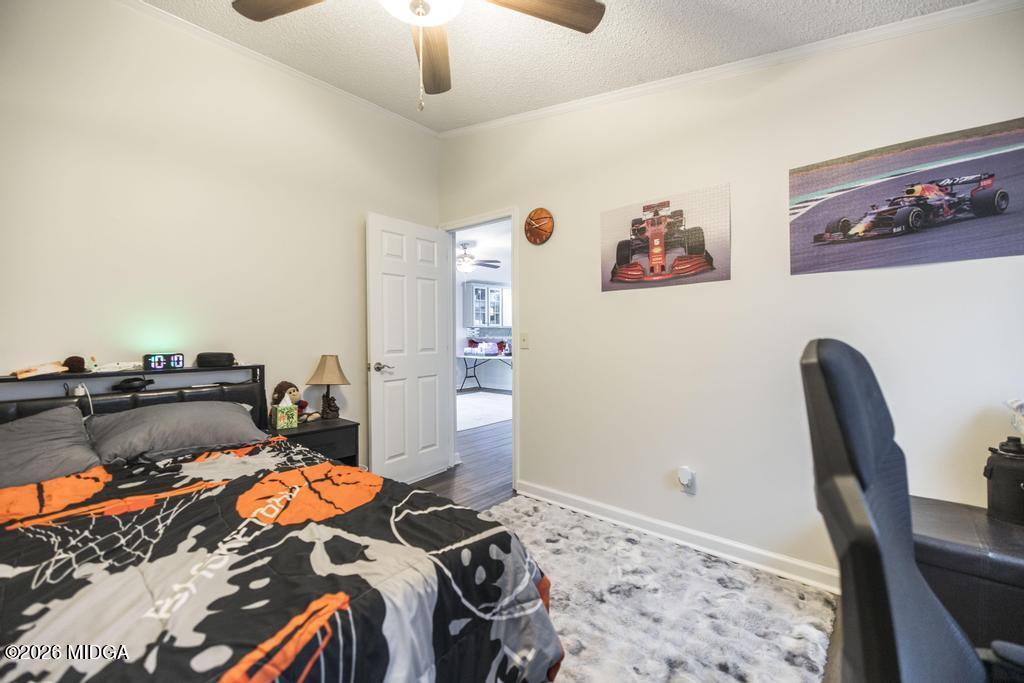 319 Pope Road Roberta, GA 31078 - Photo 29 of 42 a bedroom with bed and wooden floor