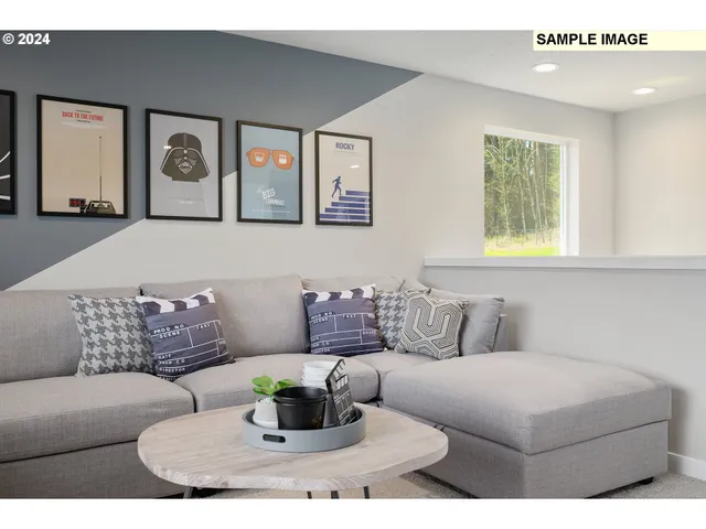 a living room with furniture and painting on the wall