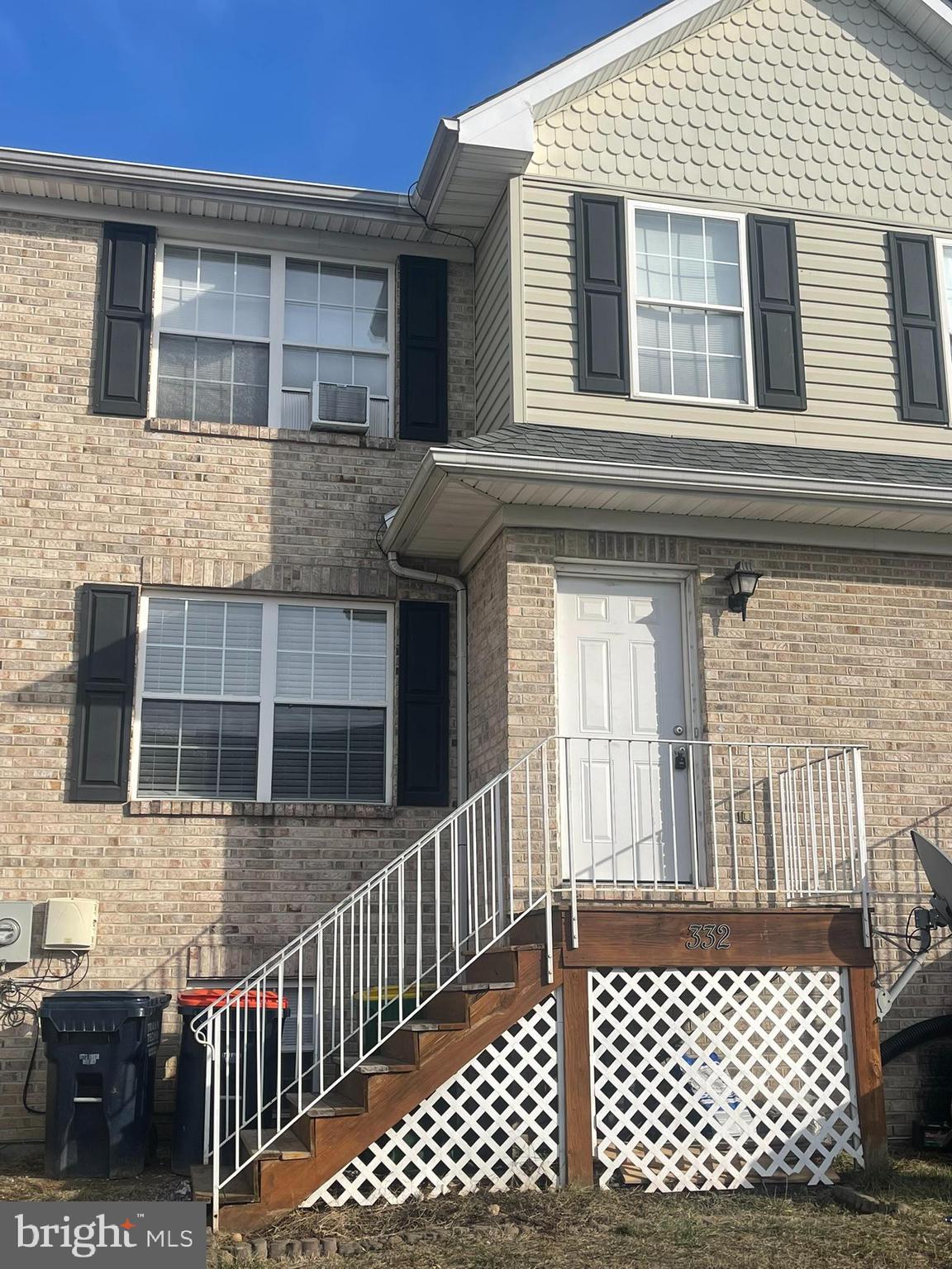 a front view of a house with a fence