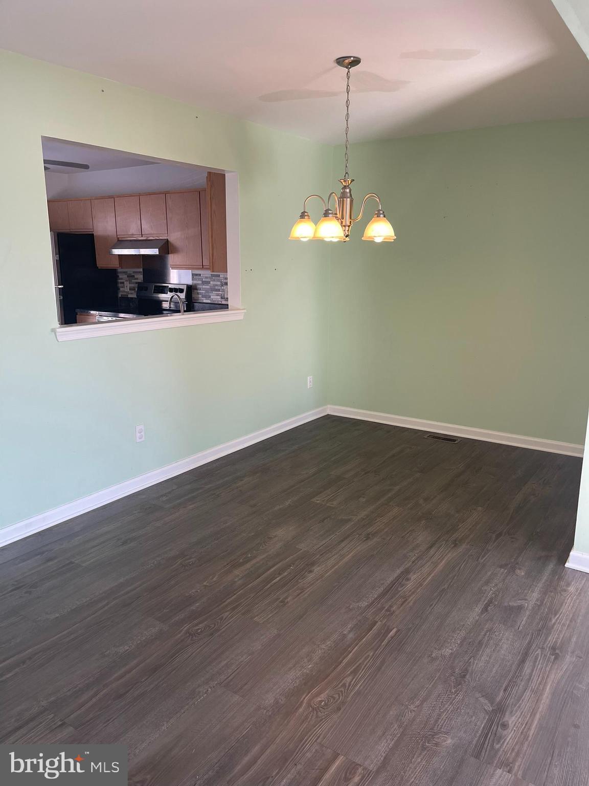 332 Liborio Drive Middletown, DE 19709 - Photo 11 of 46 a view of a kitchen with a microwave and wooden floor