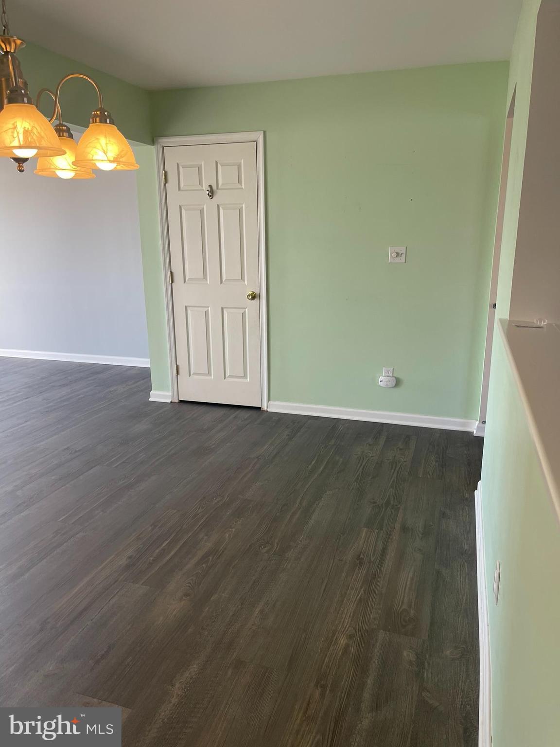 332 Liborio Drive Middletown, DE 19709 - Photo 12 of 46 an empty room with wooden floor and windows