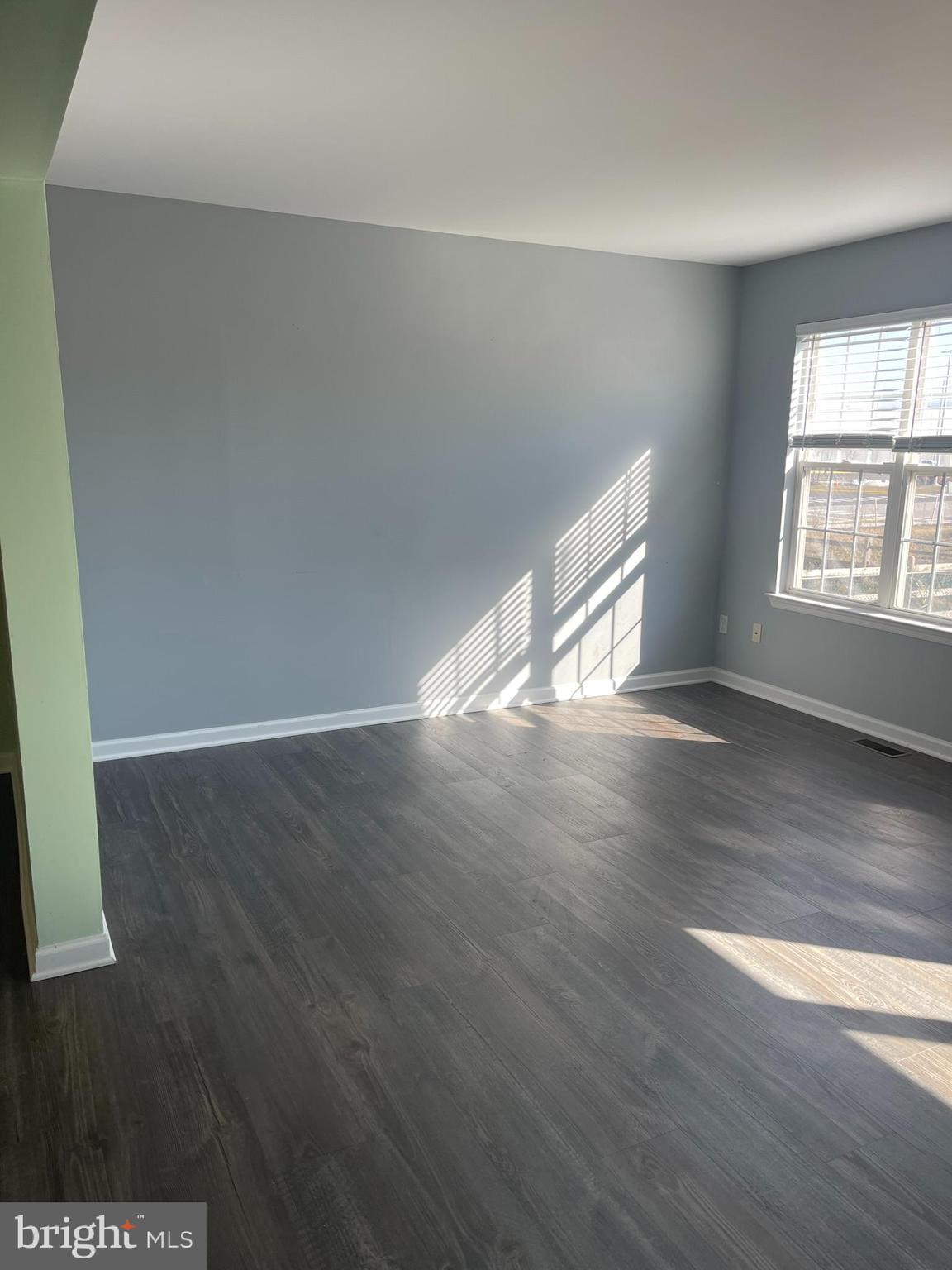 332 Liborio Drive Middletown, DE 19709 - Photo 17 of 46 wooden floor in an empty room with a window