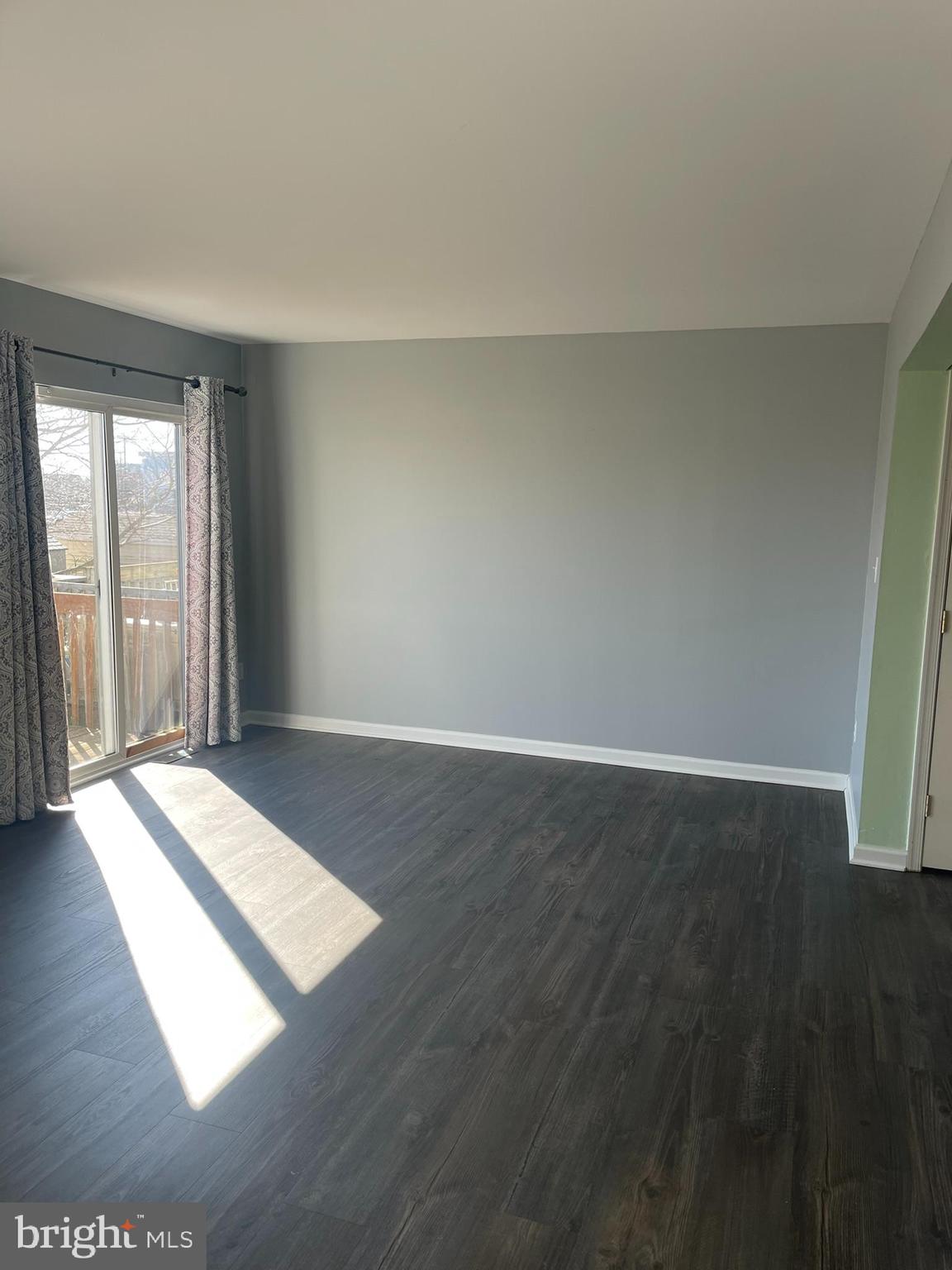 332 Liborio Drive Middletown, DE 19709 - Photo 18 of 46 a view of wooden floor and windows in a room