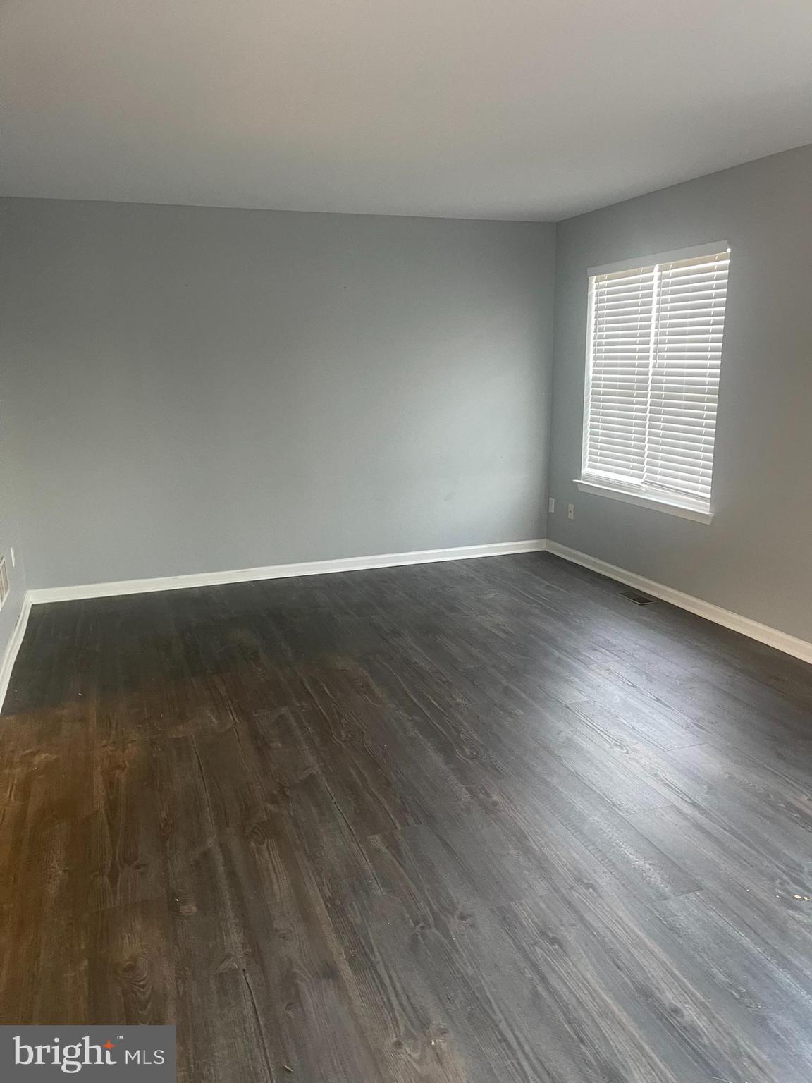 332 Liborio Drive Middletown, DE 19709 - Photo 21 of 46 a view of an empty room with wooden floor and a window