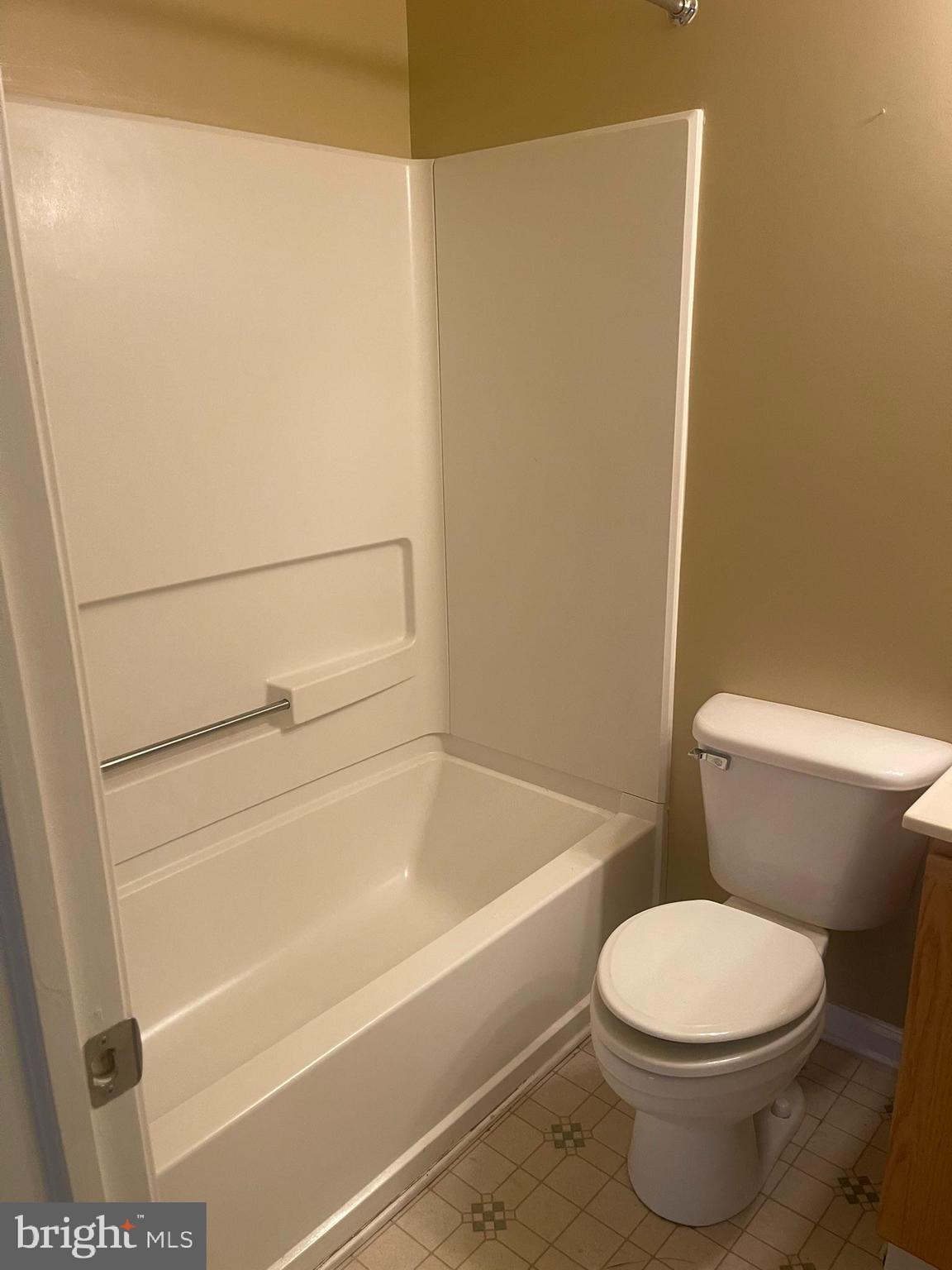 332 Liborio Drive Middletown, DE 19709 - Photo 32 of 46 a bathroom with a toilet and a bath tub