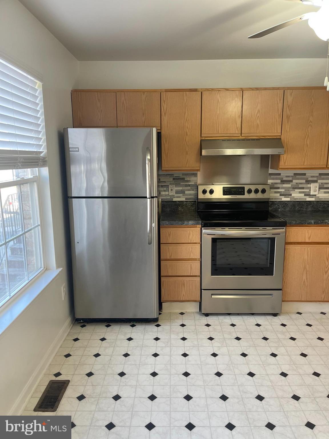 332 Liborio Drive Middletown, DE 19709 - Photo 4 of 46 a kitchen with a stove a refrigerator and cabinets
