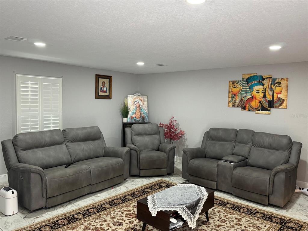 5221 Spike Horn Drive New Port Richey, FL 34653 - Photo 15 of 34 a living room with furniture and a couch