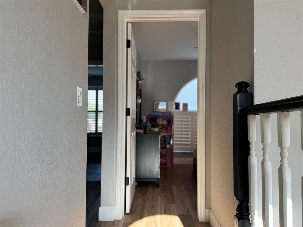 5221 Spike Horn Drive New Port Richey, FL 34653 - Photo 19 of 34 a view of a bedroom from a hallway