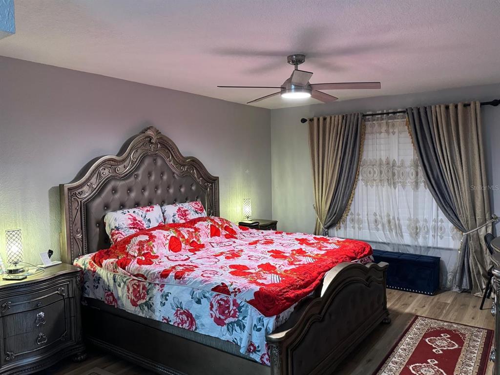 5221 Spike Horn Drive New Port Richey, FL 34653 - Photo 21 of 34 a bedroom with a bed and a dresser