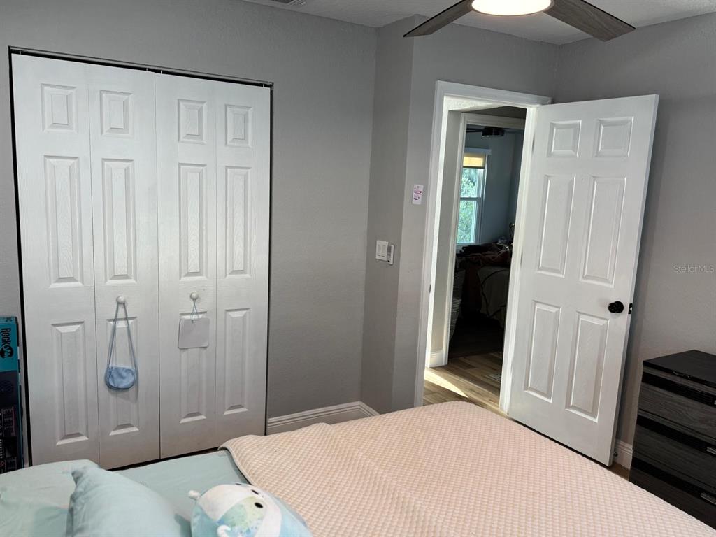 5221 Spike Horn Drive New Port Richey, FL 34653 - Photo 25 of 34 a bedroom with a bed and a shower