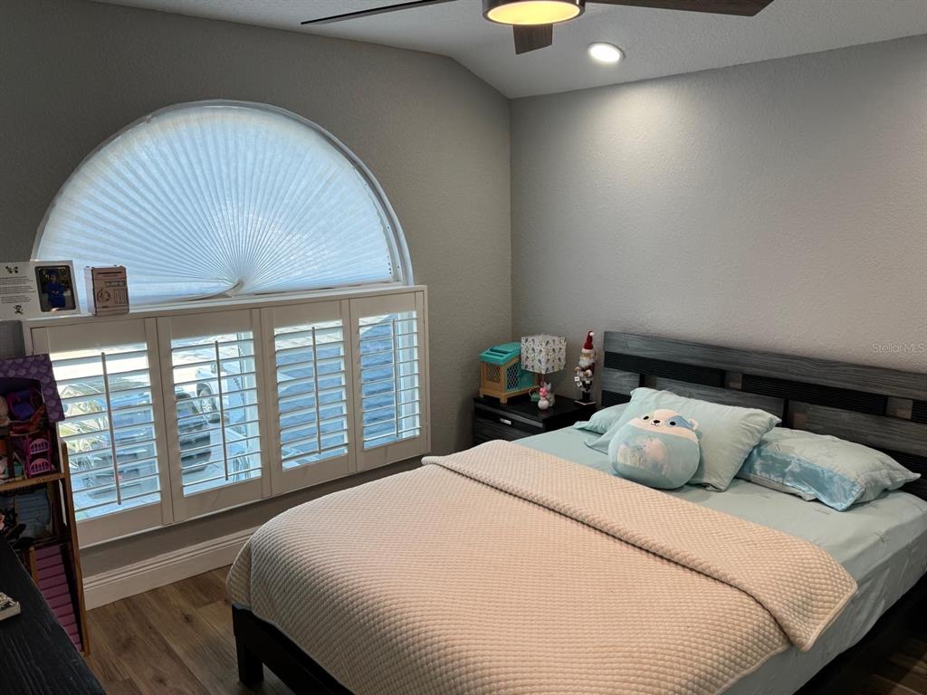 5221 Spike Horn Drive New Port Richey, FL 34653 - Photo 26 of 34 a bedroom with a bed and window