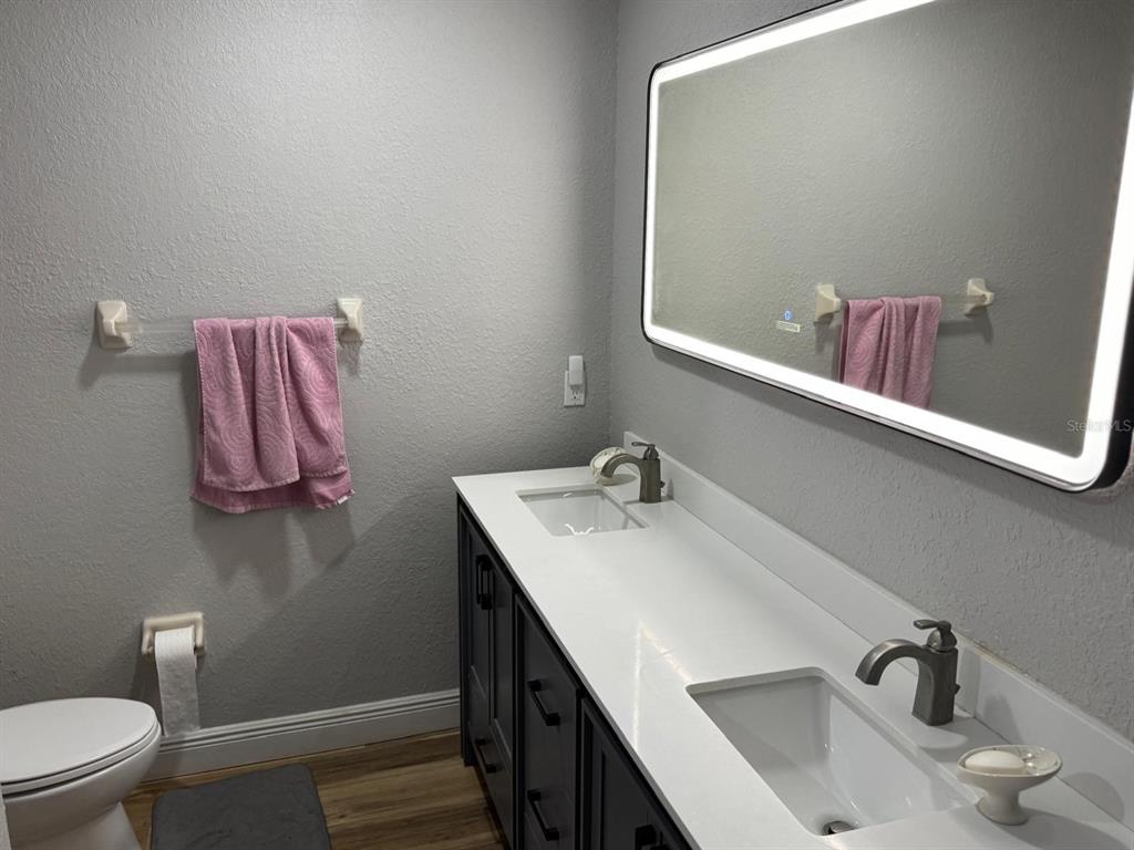 5221 Spike Horn Drive New Port Richey, FL 34653 - Photo 30 of 34 a bathroom with a sink and a mirror