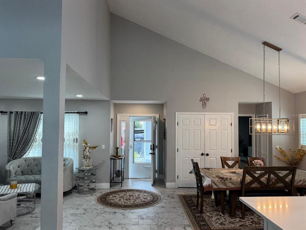5221 Spike Horn Drive New Port Richey, FL 34653 - Photo 3 of 34 a living room with furniture and a table