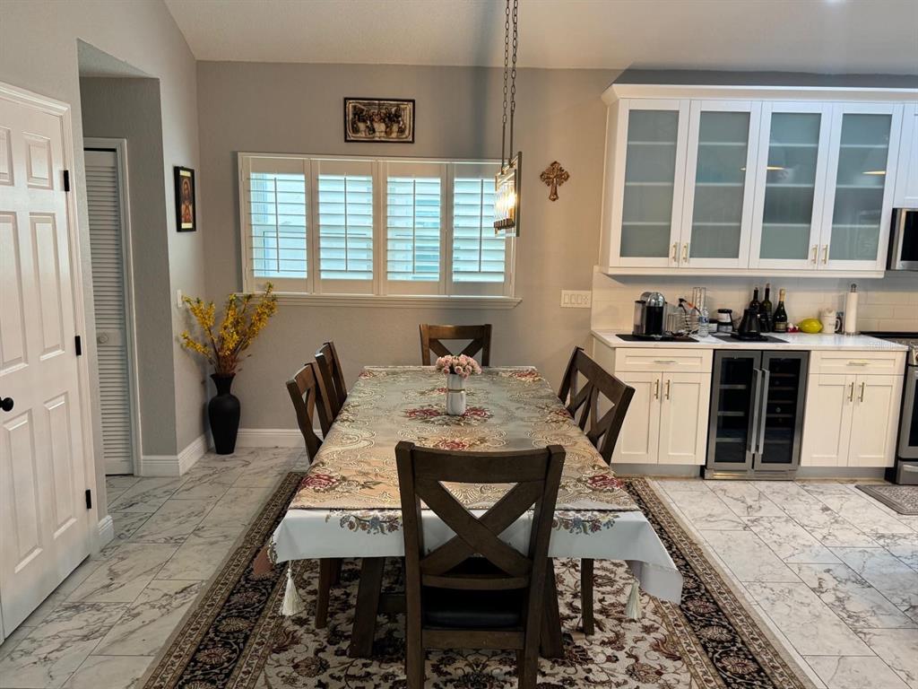 5221 Spike Horn Drive New Port Richey, FL 34653 - Photo 6 of 34 a view of a dining room with furniture and window