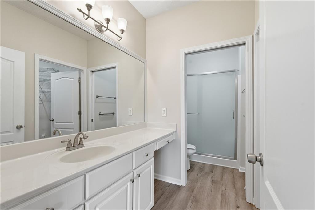 4533 Caleb Crossing, Unit 18 Powder Springs, GA 30127 - Photo 14 of 24 a bathroom with a sink double vanity and a mirror