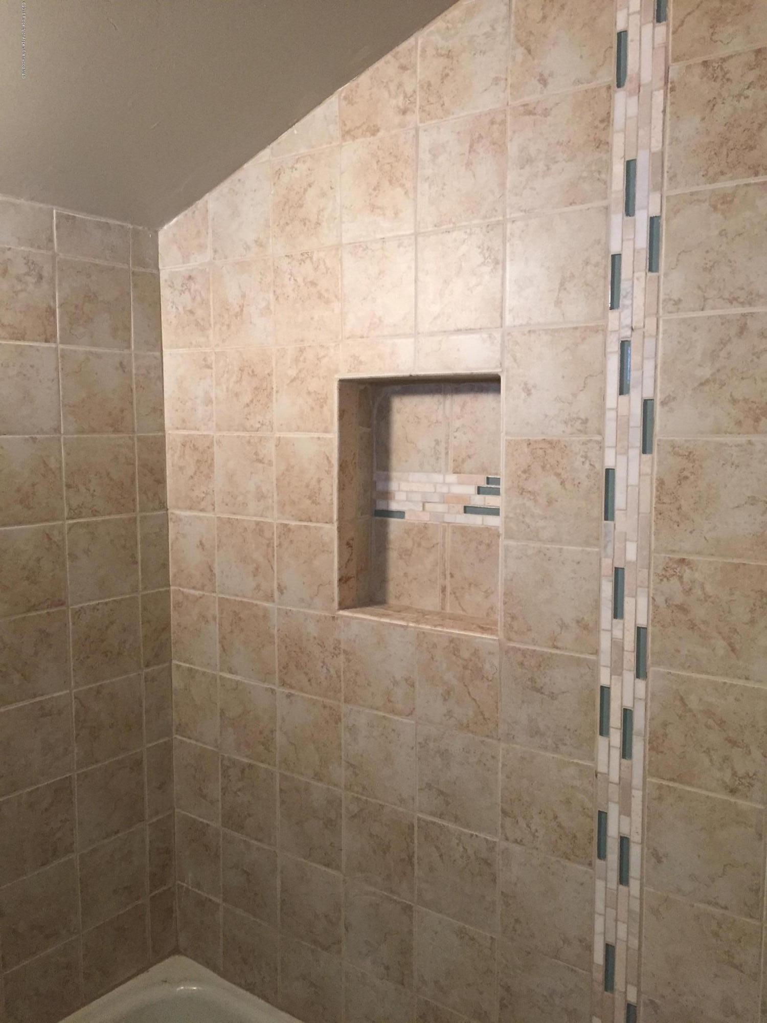 400 East 2nd Street Rifle, CO 81650 - Photo 8 of 22 a bathroom with a shower