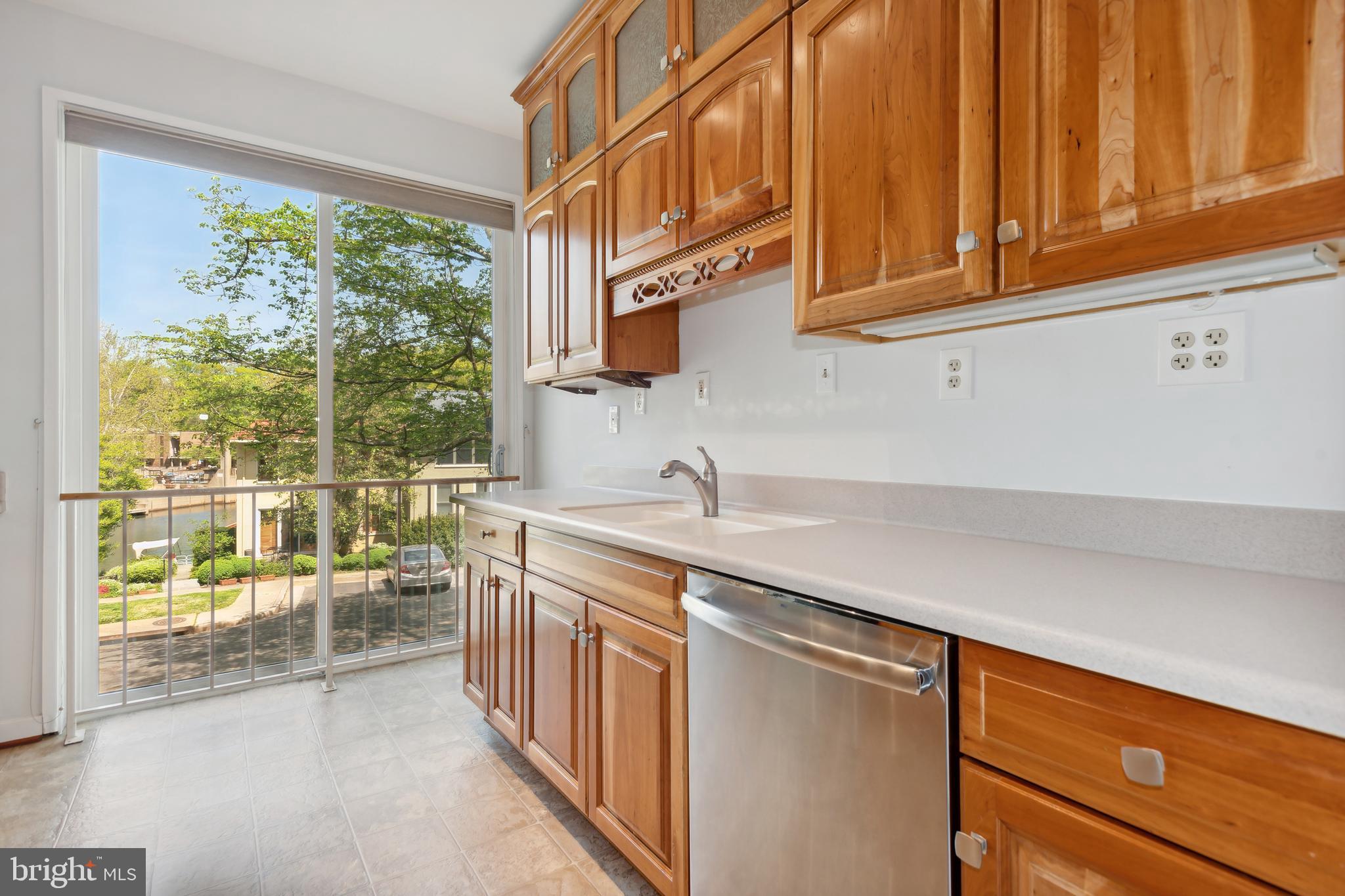 11439 Waterview Cluster Reston, VA 20190 - Photo 19 of 61 a kitchen with stainless steel appliances granite countertop a sink and a cabinets