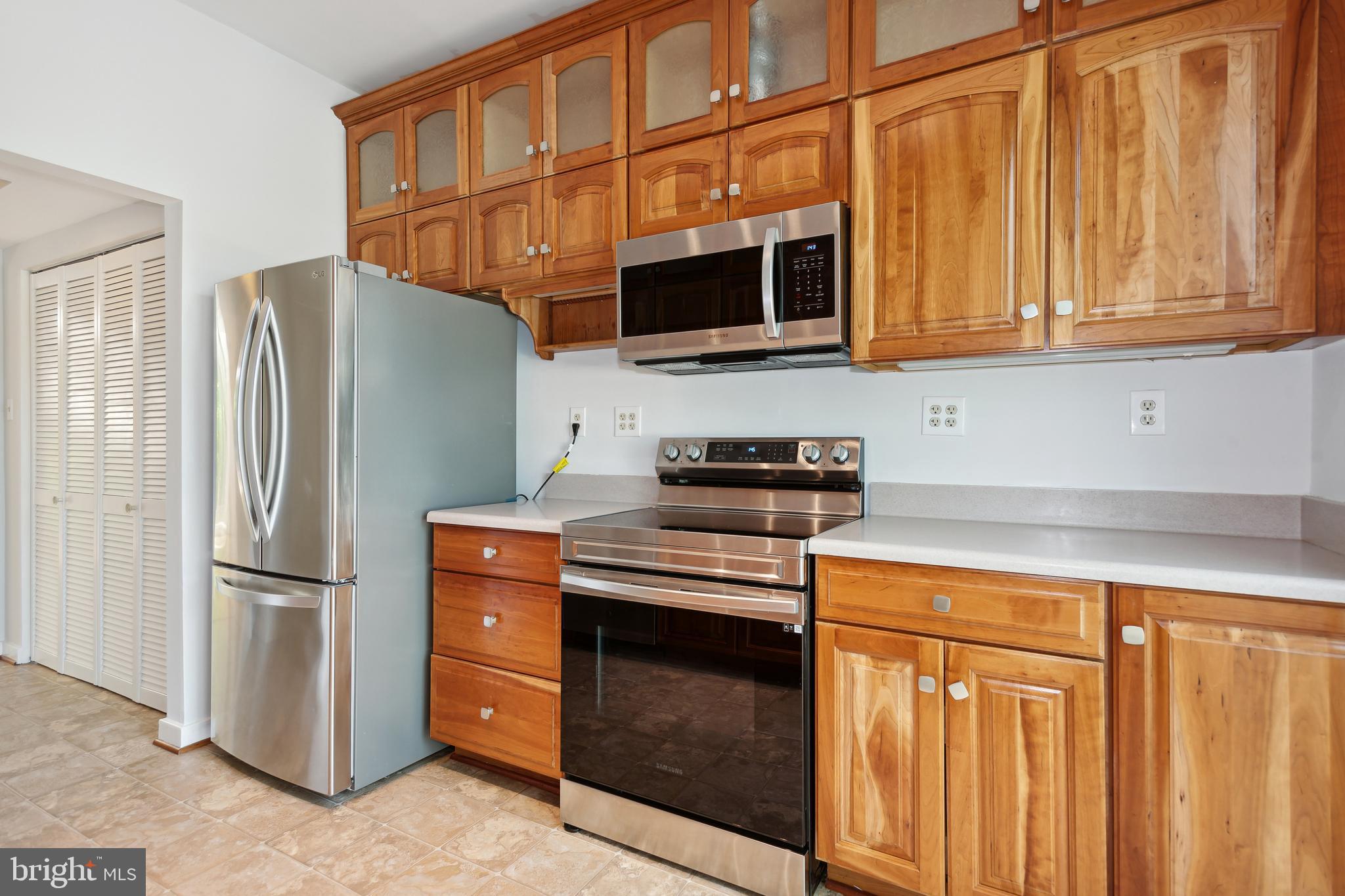 11439 Waterview Cluster Reston, VA 20190 - Photo 20 of 61 a kitchen with stainless steel appliances granite countertop a refrigerator and a stove top oven