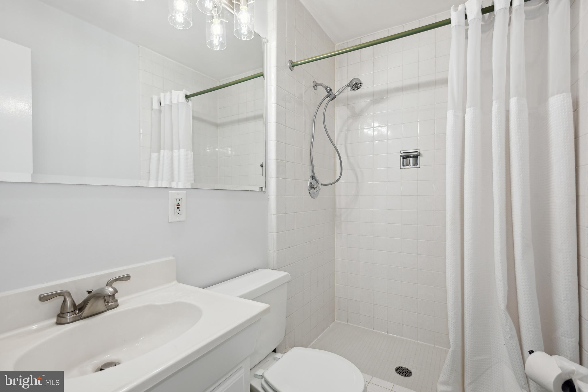 11439 Waterview Cluster Reston, VA 20190 - Photo 23 of 61 a bathroom with a sink toilet and shower