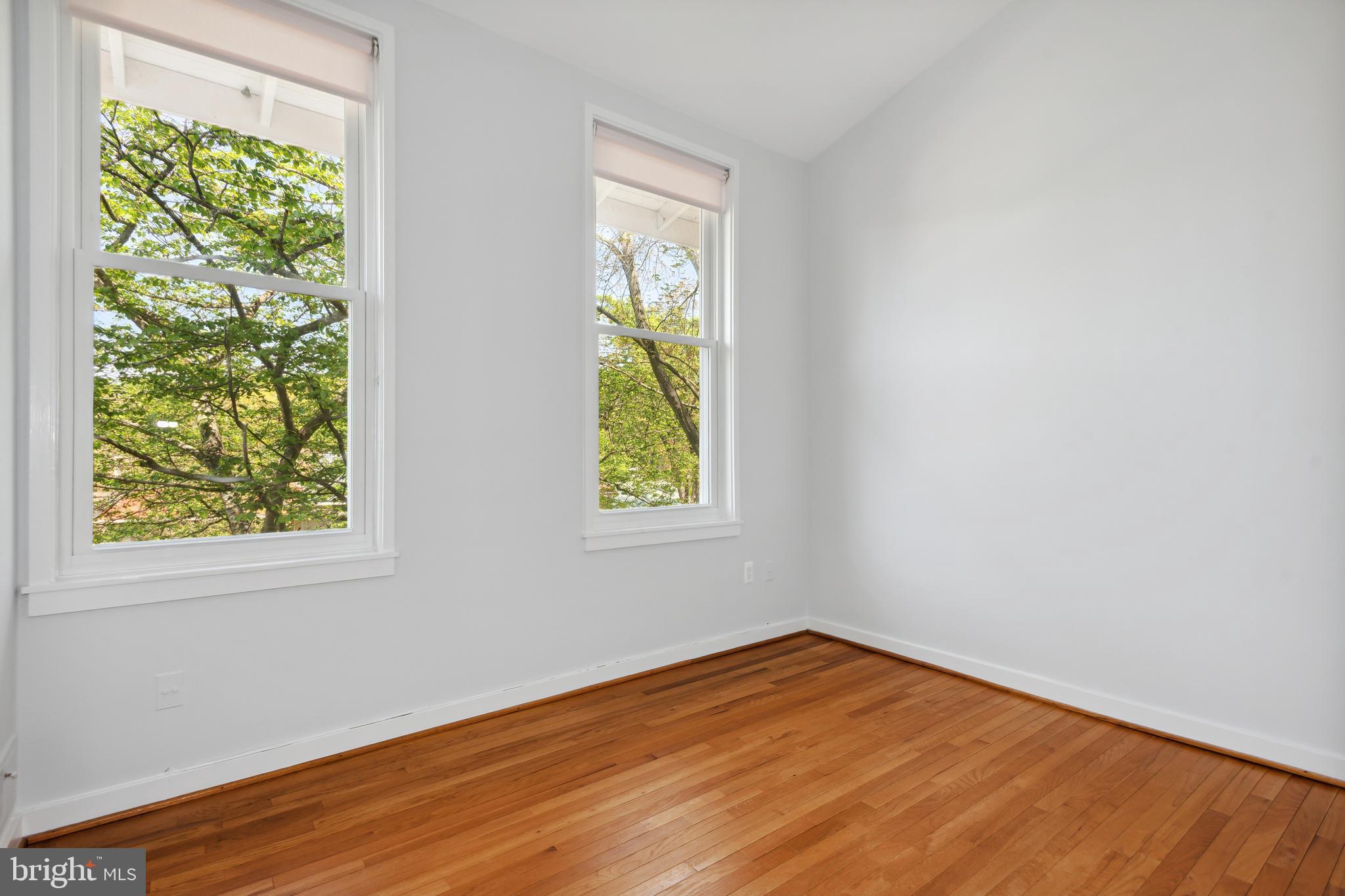 11439 Waterview Cluster Reston, VA 20190 - Photo 30 of 61 an empty room with wooden floor and windows