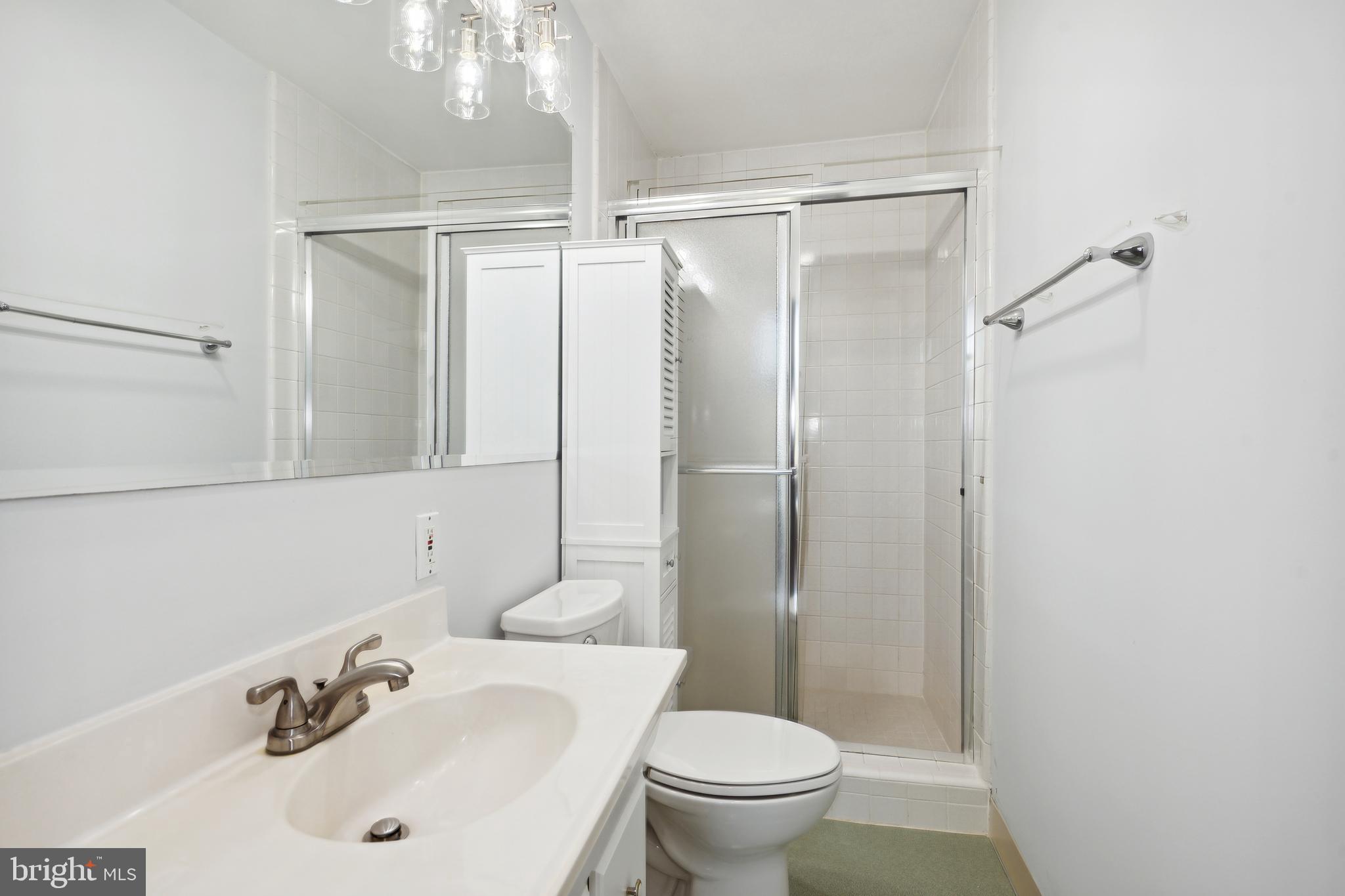 11439 Waterview Cluster Reston, VA 20190 - Photo 32 of 61 a bathroom with a sink toilet and shower
