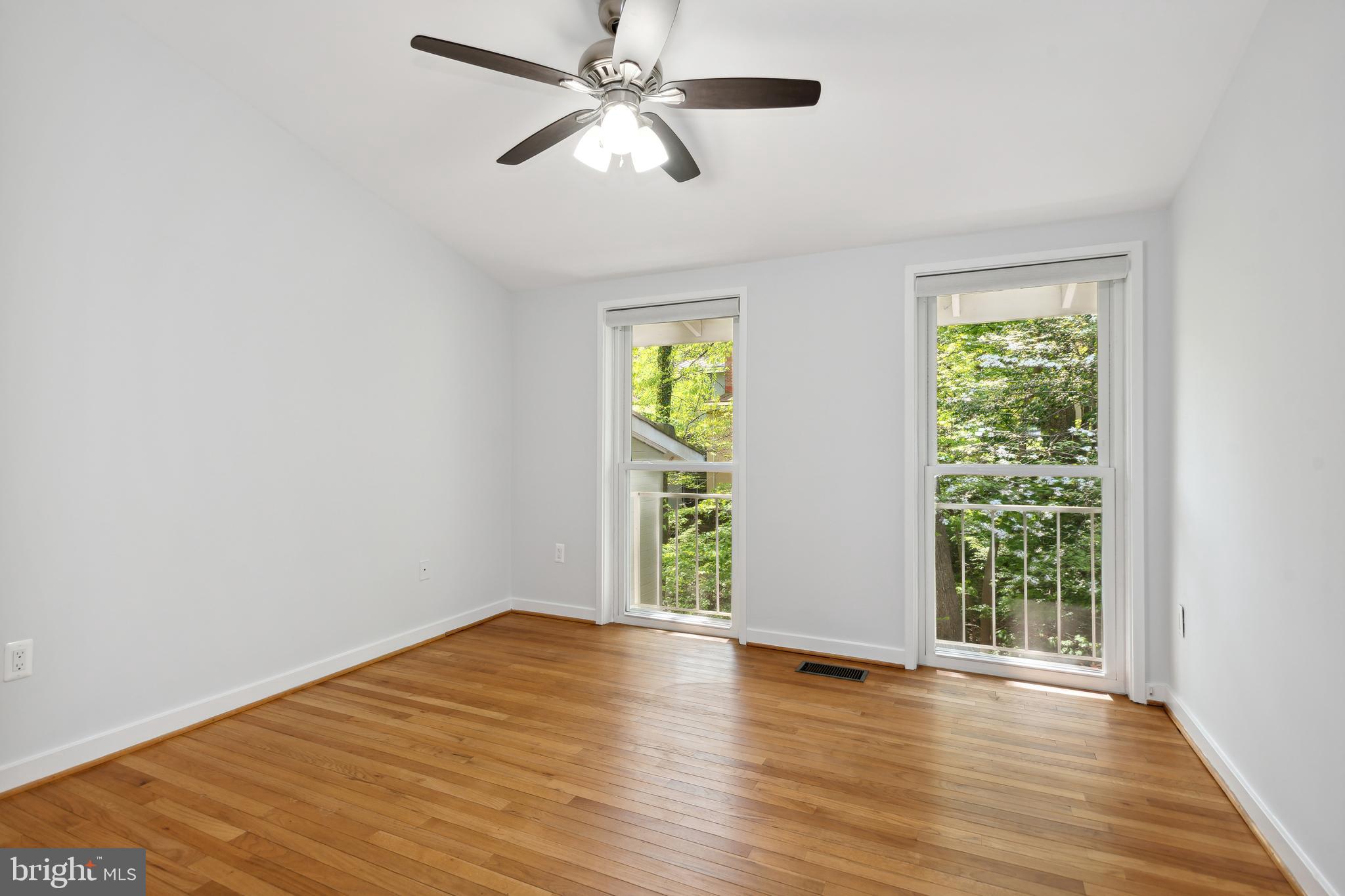 11439 Waterview Cluster Reston, VA 20190 - Photo 33 of 61 wooden floor in an empty room with a window