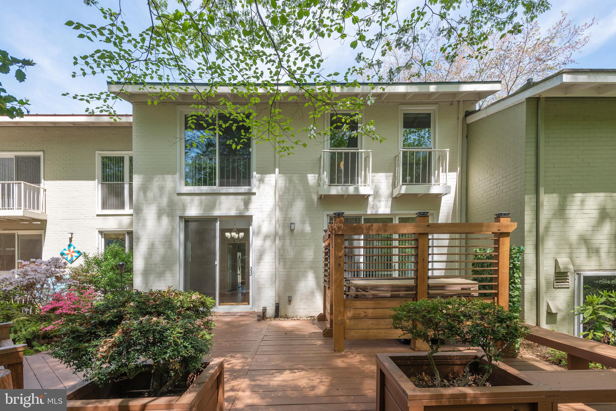 11439 Waterview Cluster Reston, VA 20190 - Photo 41 of 61 a front view of a house with a garden