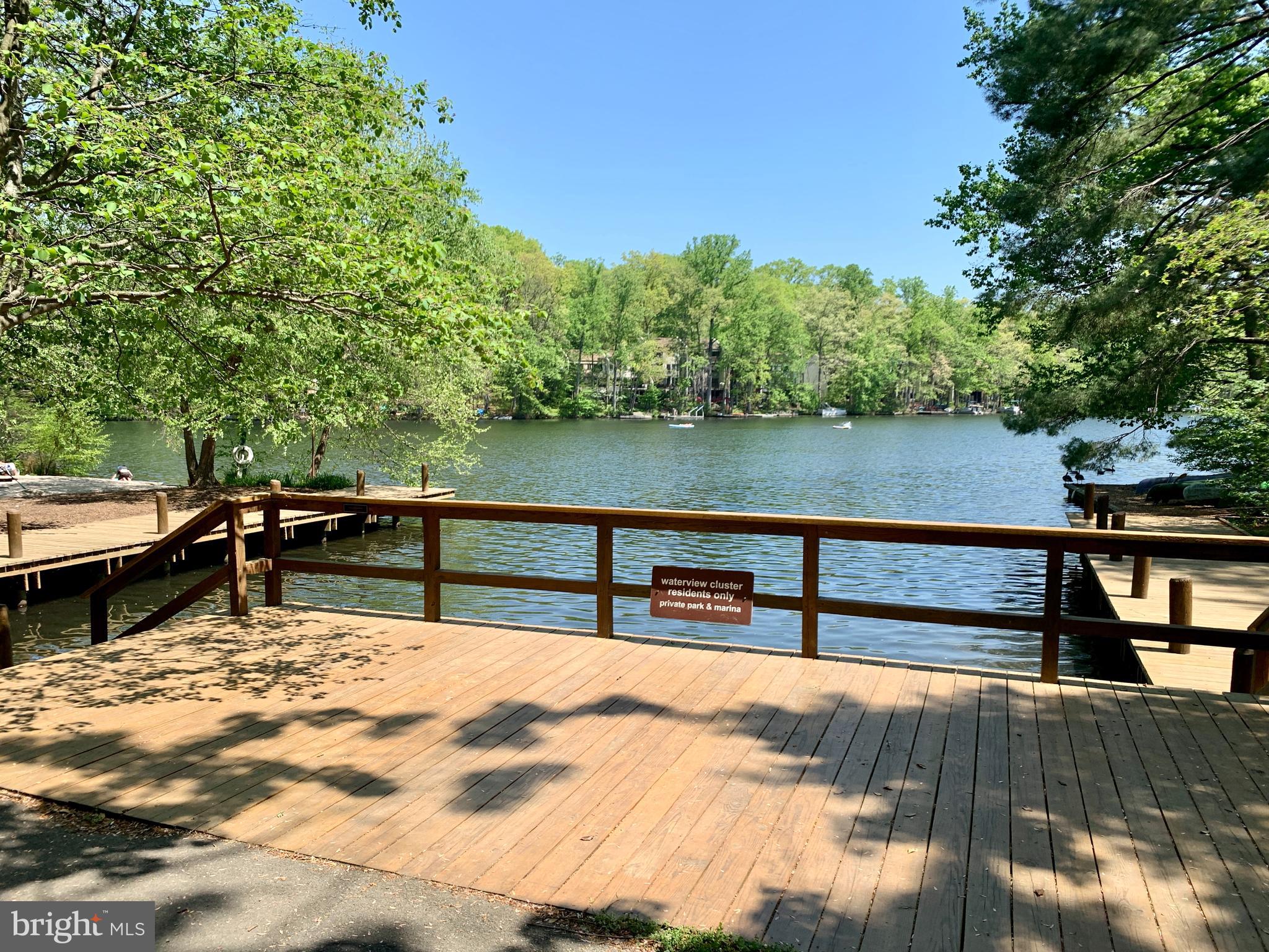 11439 Waterview Cluster Reston, VA 20190 - Photo 46 of 61 a view of swimming pool with seating area and trees