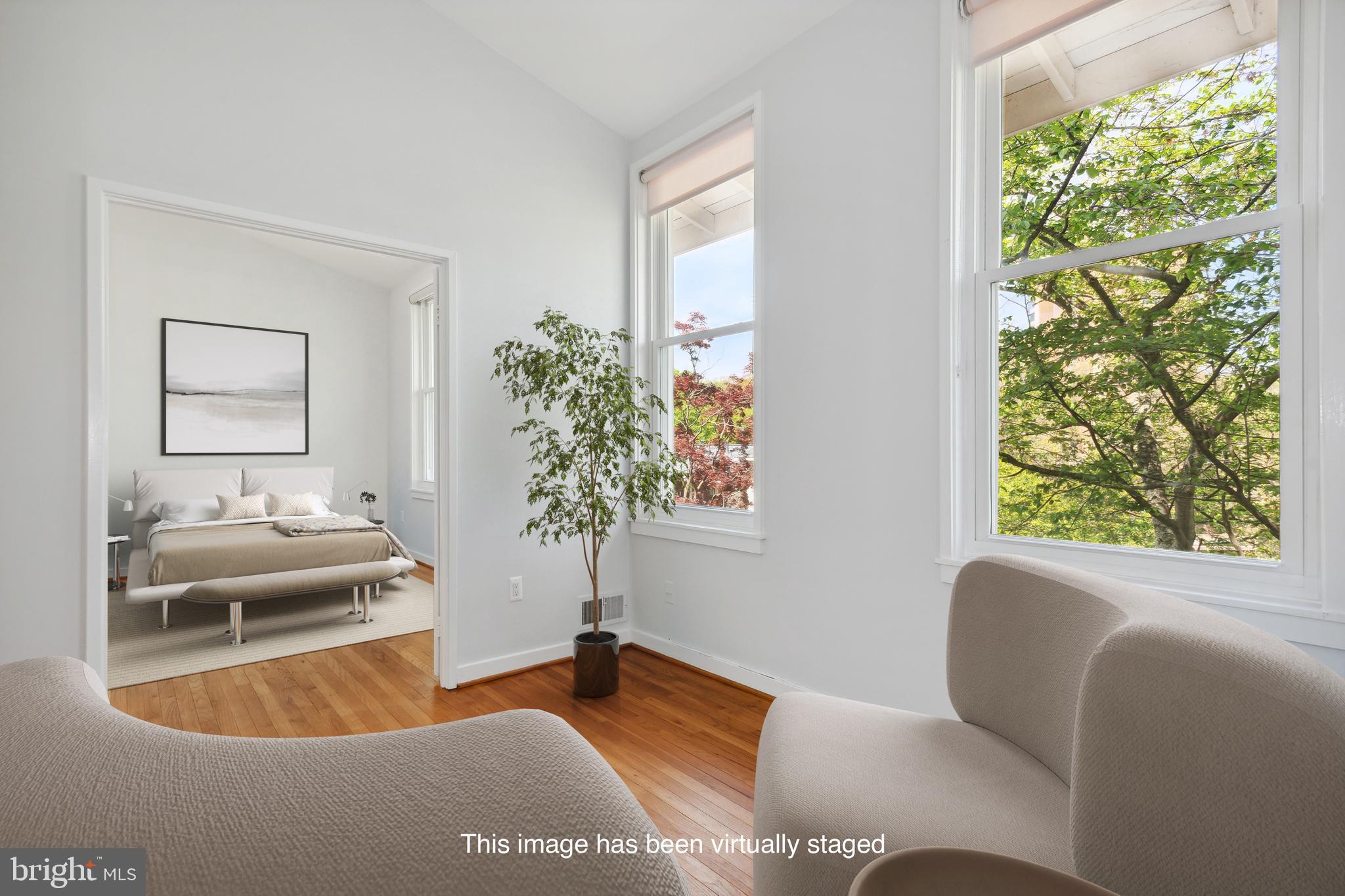 11439 Waterview Cluster Reston, VA 20190 - Photo 6 of 61 a living room with furniture and a potted plant