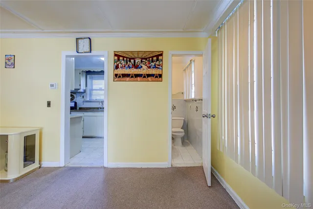 a view of a hallway with wooden shelves