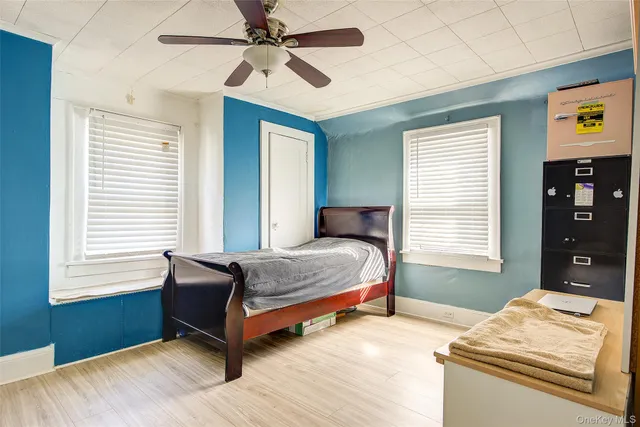 a bedroom with furniture and a window