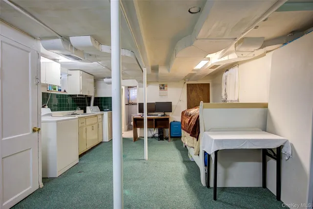 a view of an entryway with workspace and windows