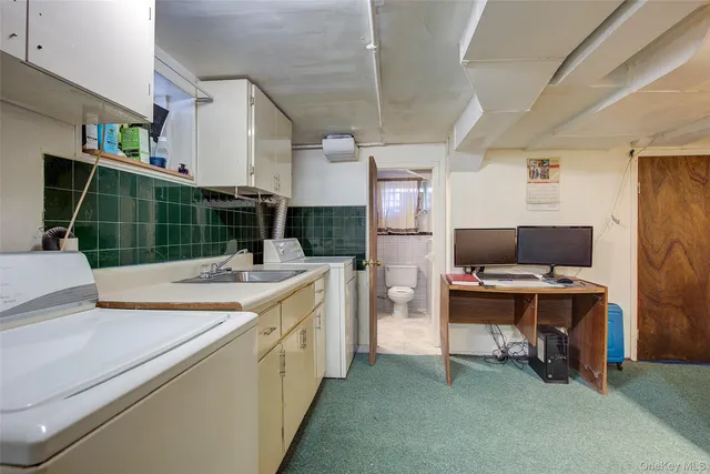 a kitchen with a sink and cabinets