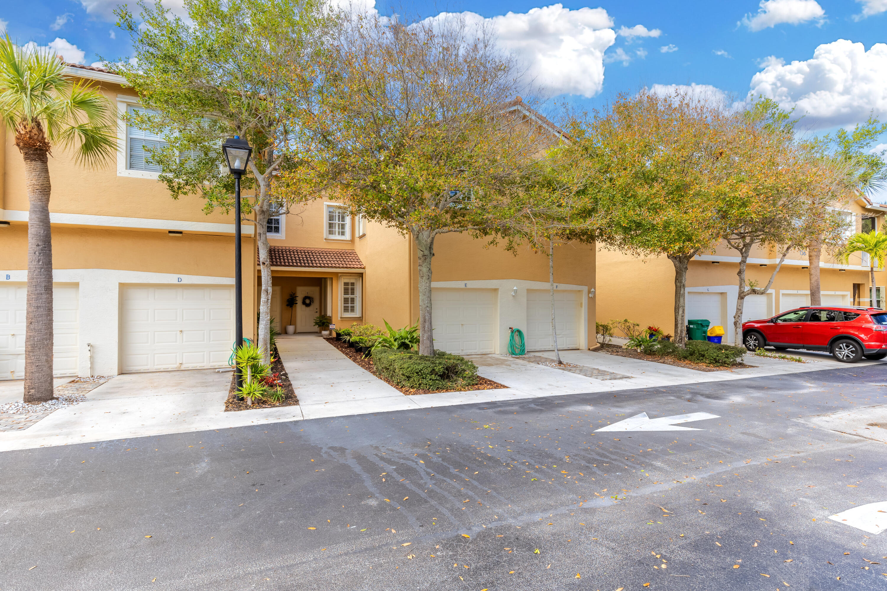 156 Village Boulevard, Unit E Tequesta, FL 33469 - Photo 1 of 36 a view of a house with a street