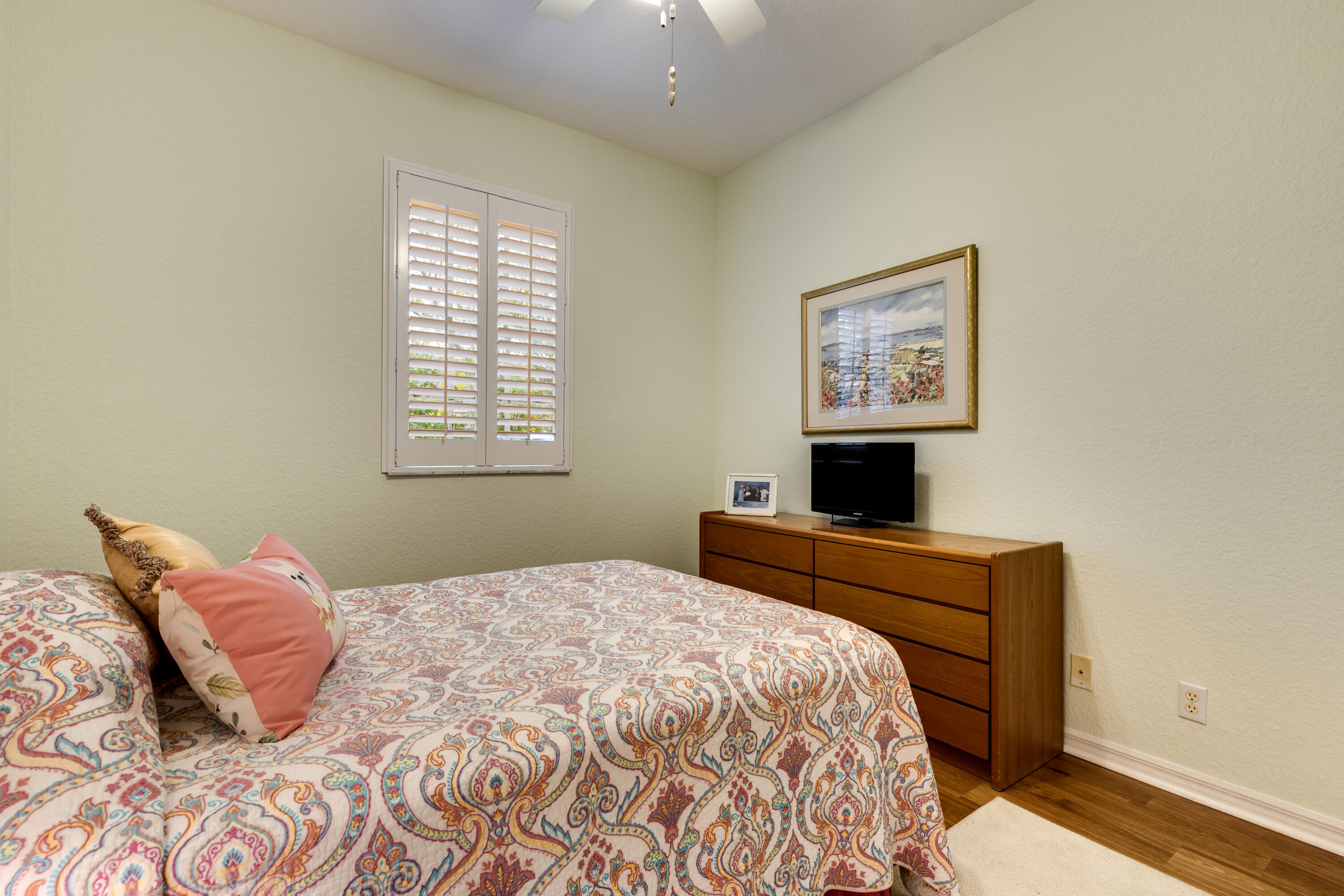 156 Village Boulevard, Unit E Tequesta, FL 33469 - Photo 30 of 36 a bedroom with a large bed and a window