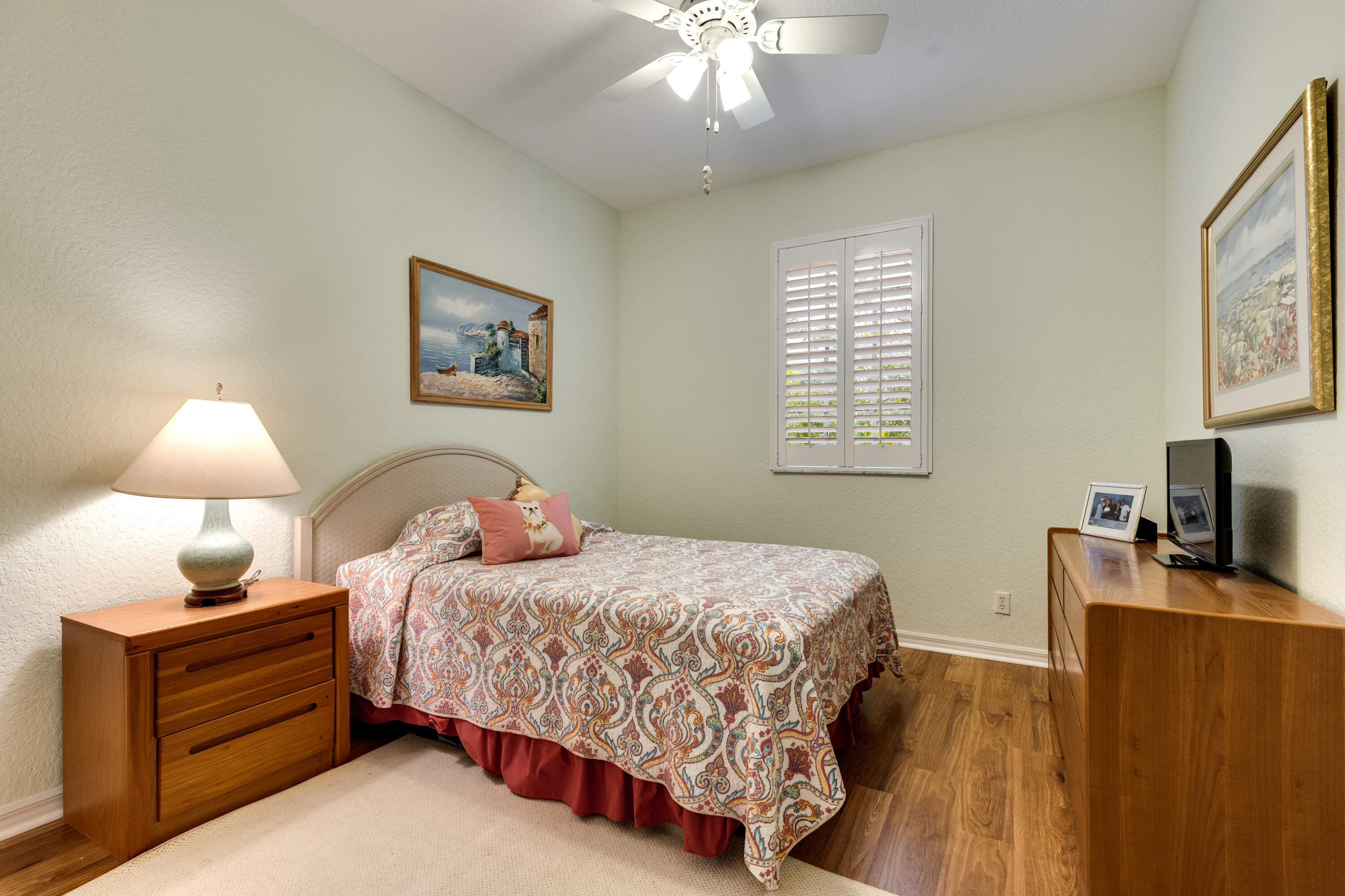 156 Village Boulevard, Unit E Tequesta, FL 33469 - Photo 31 of 36 a bedroom with a bed furniture and a window