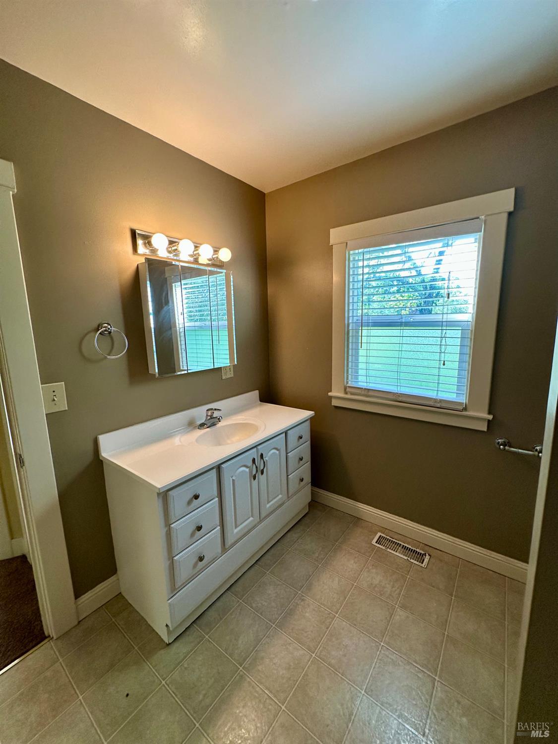 994 Sanitarium Road Deer Park, CA 94576 - Photo 13 of 21 a spacious bathroom with a sink a vanity and a mirror