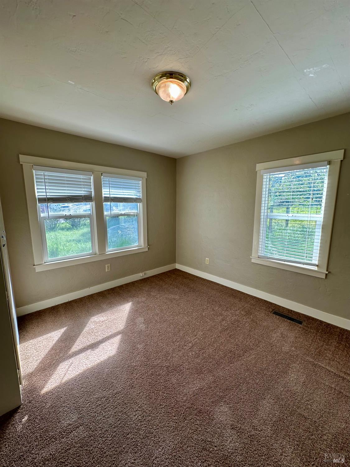 994 Sanitarium Road Deer Park, CA 94576 - Photo 14 of 21 an empty room with windows