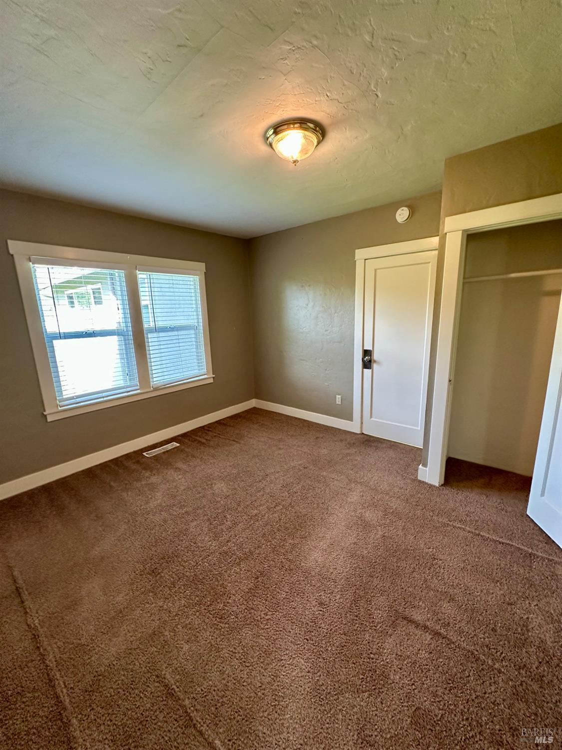 994 Sanitarium Road Deer Park, CA 94576 - Photo 15 of 21 an empty room with windows and closet