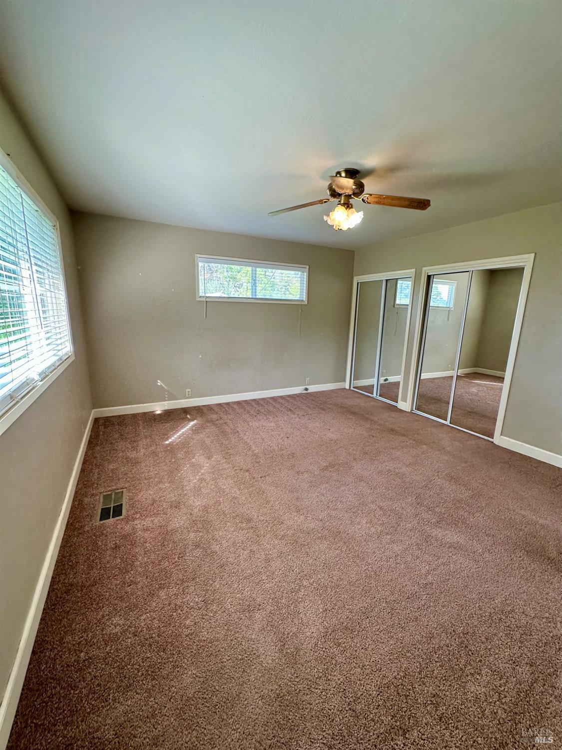 994 Sanitarium Road Deer Park, CA 94576 - Photo 17 of 21 an empty room with windows and fan